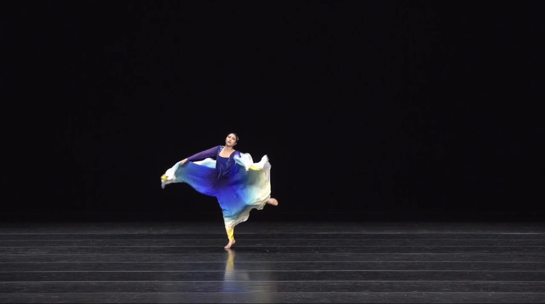Dayeon Lee turning during a contemporary Korean dance performance